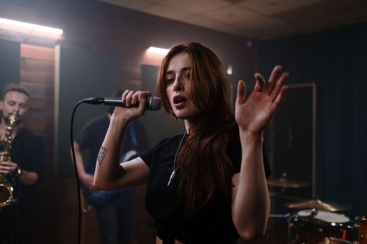 Singer performing on a stage