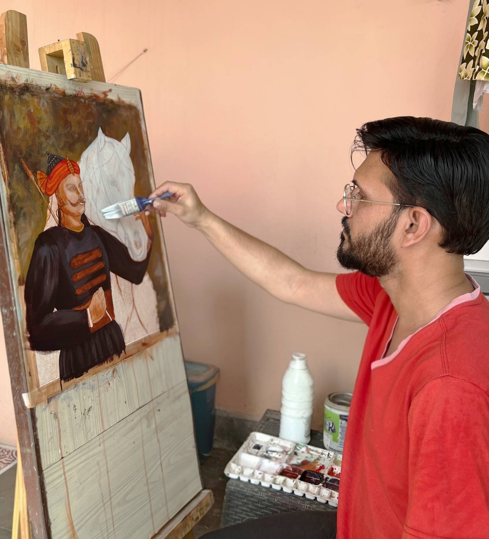 Artist painting on a colorful canvas