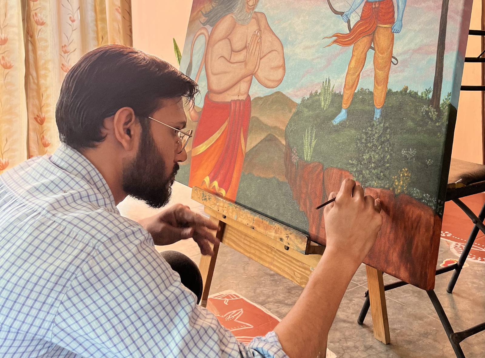 Artist painting on a colorful canvas
